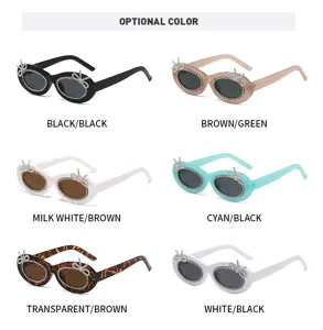 Elegante ovale Strass Sonnenbrille mit Schleifen Detail für Damen Mode und Streetwear.