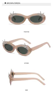 Elegante ovale Sonnenbrille mit Strasssteinen und niedlichen Schleifen für modebewusste Frauen.