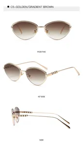 Gafas de sol de ojo de gato de metal dorado con lentes degradadas marrones.