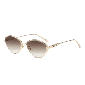 Elegantes gafas de sol cat eye de metal dorado con lentes degradadas marrones mujer.