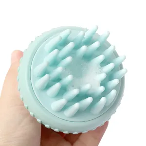 Green silicone pet bath brush with soft bristles and foaming design for dog shower.