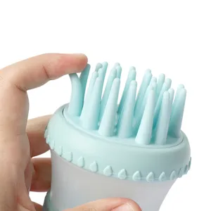 Pet bath brush with soft silicone bristles and soap dispenser for dogs and cats cleaning.
