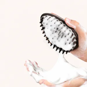 Handheld pet bath brush and grooming comb for dogs and cats, easy cleaning and massage.