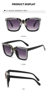 Fashion large-frame rhinestone sunglasses with gradient lenses and butterfly crystal decor.