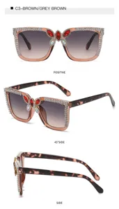 Fashion large frame rhinestone sunglasses with crystal butterfly decor and gradient lenses for women.