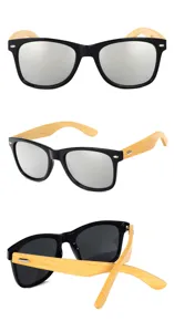 Detalles de gafas de sol retro con montura negra, patillas de bambú natural y lentes plateadas.