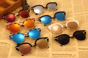 Retro round sunglasses with colorful mirrored lenses, stylish metal brow line frames for women.