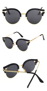Retro black and gold sunglasses for women, chic half-frame design with dark UV protection lenses.