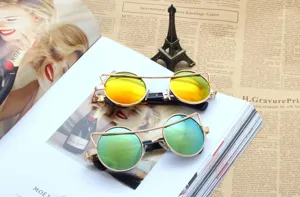 Stylish vintage metal sunglasses with mirrored lenses, unique round frame design for street fashion.