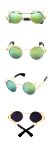 Stylish gold metal frame sunglasses with green reflective round lenses and cat-eye top bar design.
