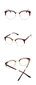 Detailed view of vintage semi-rimless optical glasses frame with tortoise and gold metal.