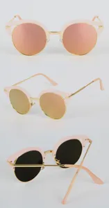 Chic vintage round sunglasses for women featuring trendy pink frames and gold metal accents.