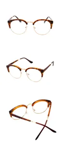 Detailed view of retro browline optical glasses frames with tortoise shell and gold metal finish.