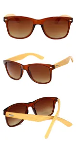 Vista detallada de gafas de sol vintage con patillas de bambú, lentes degradadas y marco artesanal.