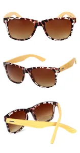 Vista detallada de gafas de sol vintage con estampado de leopardo y patillas de bambú.
