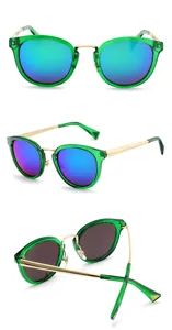 Green frame sunglasses with blue reflective lenses and gold temples fashion eyewear details.