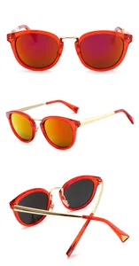 Red frame reflective sunglasses detailed view showing stylish metal temples and lenses.