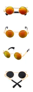 Trendy round metal sunglasses with striking orange reflective lenses and unique cat ear frame detail.