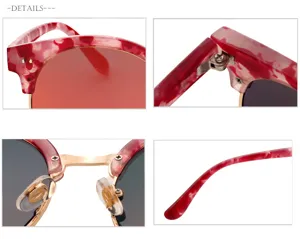 Vista dettagliata di occhiali da sole con motivo rosso, evidenziando cerniera e ponte.