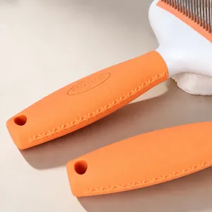Orange pet slicker brush handle with soft rubber grip and anti-slip texture for grooming.