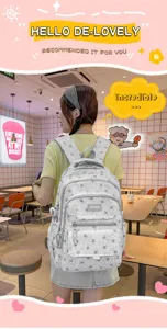 Stylish grey star pattern school backpack for girls shown in a cozy cafe lifestyle setting