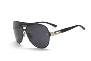 Detailed view of trendy oversized shield sunglasses with dark lenses and metallic bridge accent.