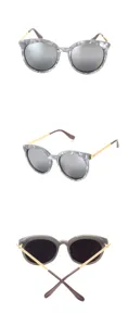 Stilvolle Damen Sonnenbrille mit Marmormuster, goldenen Bügeln und verspiegelten Gläsern