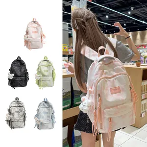 Tie-dye fashion school backpack for students with multiple compartments and cute charm