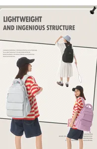 Large capacity lightweight student backpacks in multiple colors shown on models