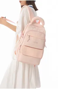 Close-up of a soft pink Japanese style large capacity school backpack on a model
