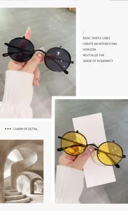 Détail de lunettes de soleil rondes vintage avec monture en métal et double verres.