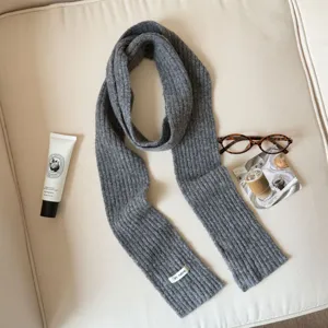 Grey ribbed knit scarf for women, cozy winter long scarf with a small woven label design.