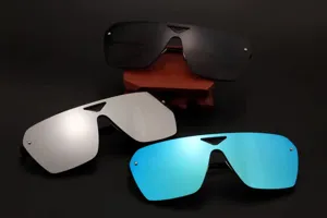 Close-up detail of fashion oversized shield sunglasses with mirror lenses in multi-colors.