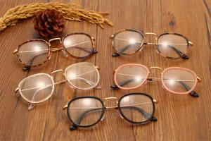 Lunettes vintage à monture en métal et verres ovales, style rétro élégant pour la mode quotidienne.