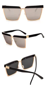 Dettaglio occhiali da sole quadrati oversize con montatura in metallo nero e oro.