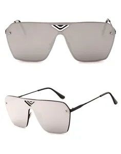 Close-up detail of stylish oversized flat top sunglasses featuring a unique V-cut bridge.