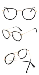 Vue détaillée de montures de lunettes optiques ovales vintage au design noir et or élégant.