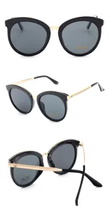 Lunettes de soleil cat eye tendance pour femme monture noire branches métal verres UV400.