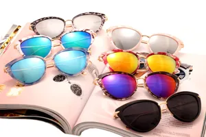 Stylish cat-eye sunglasses with colorful reflective lenses and leopard print frames for fashion lovers.