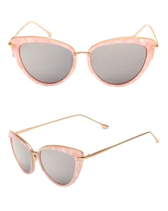 Detailed view of pink marbled cat-eye sunglasses with gold metal temples and silver mirrored lenses.