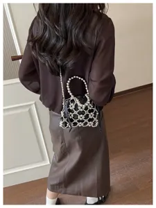 Chic metallic beaded hollow crossbody bag with inner pouch, stylish accessory for women.