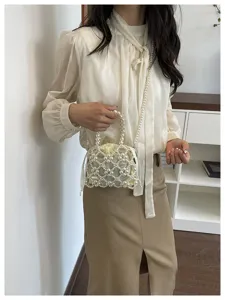 Elegant handmade pearl beaded handbag and crossbody bag with drawstring inner pouch.