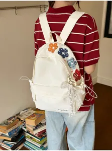 Japanischer Harajuku Stil Canvas Rucksack mit bunter Blumenstickerei und süßer Schleife.