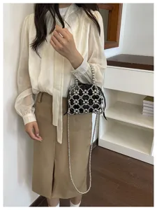 Chic metallic beaded crossbody bag with hollow mesh design and drawstring lining for women.