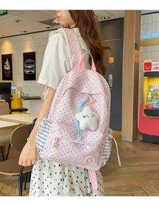 Cute pink star pattern canvas backpack for school girls, casual large capacity daily daypack.