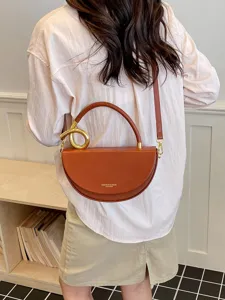 Schicke Halbmond Umhängetasche für Damen, elegante Ledertasche mit Metallgriff und Schulterriemen.