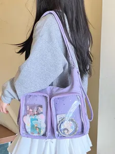 Purple Harajuku style ita bag with silver star print and dual clear display pockets.