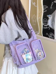 Detail view of a purple star-patterned ita bag with anime merch in clear pockets.