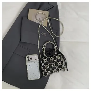 Elegant beaded crossbody bag with hollow design, stylish mini hand bag for women and girls.