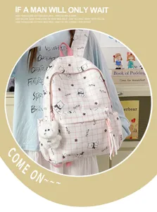 Cute pink plaid backpack with cartoon bear patterns and a soft plush bear keychain